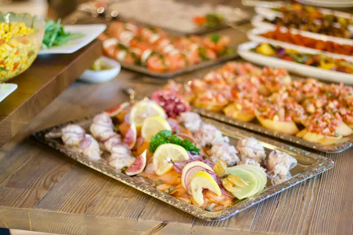 assorted foods on tray on wooden surface